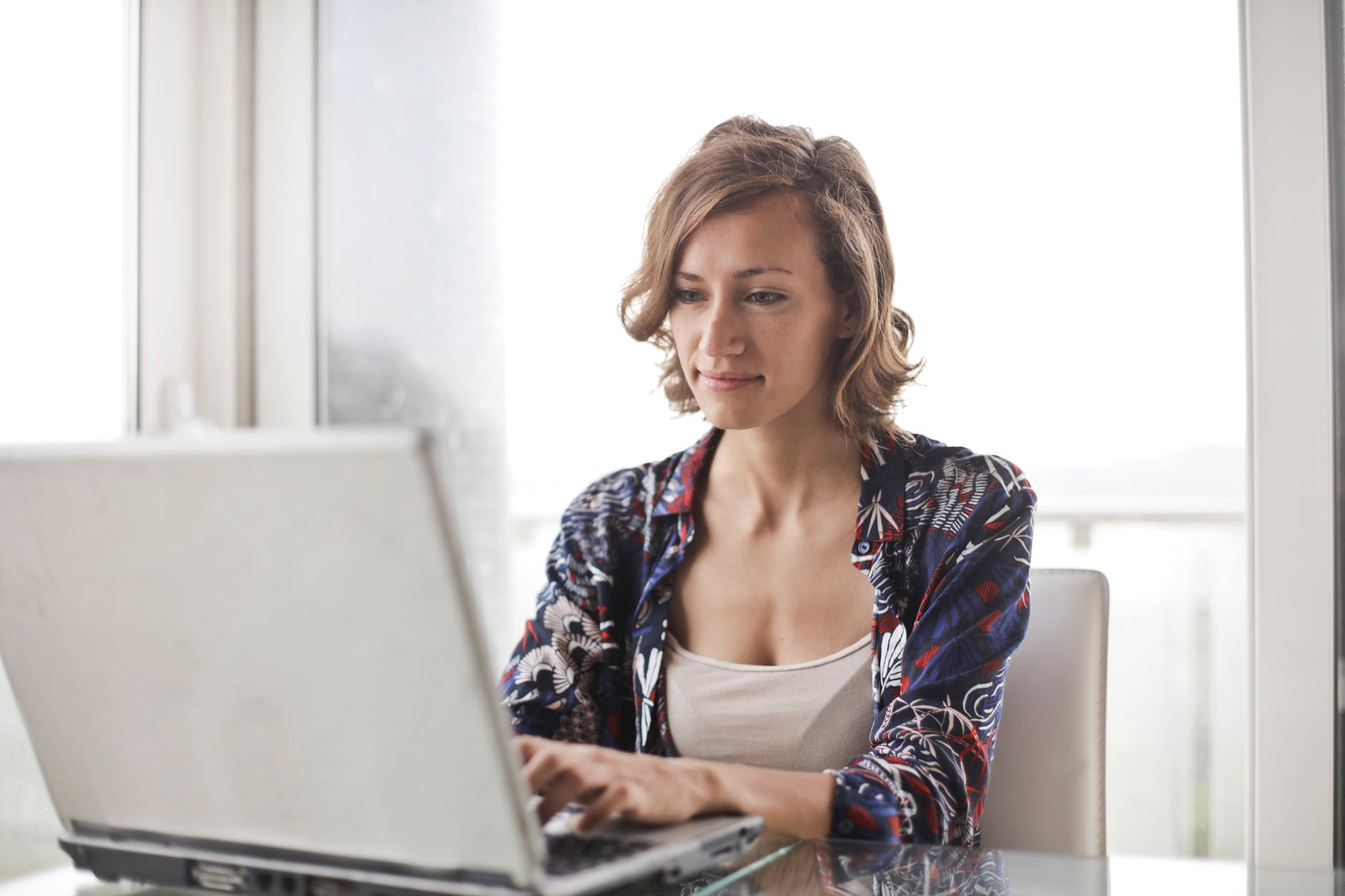 female bookkeeper working at laptop