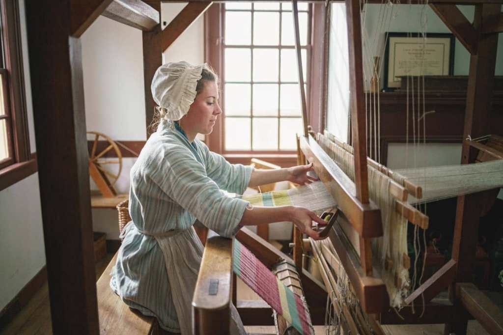 weaver using cotton loom